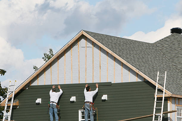 Professional Siding technician working in Commerce City, CO